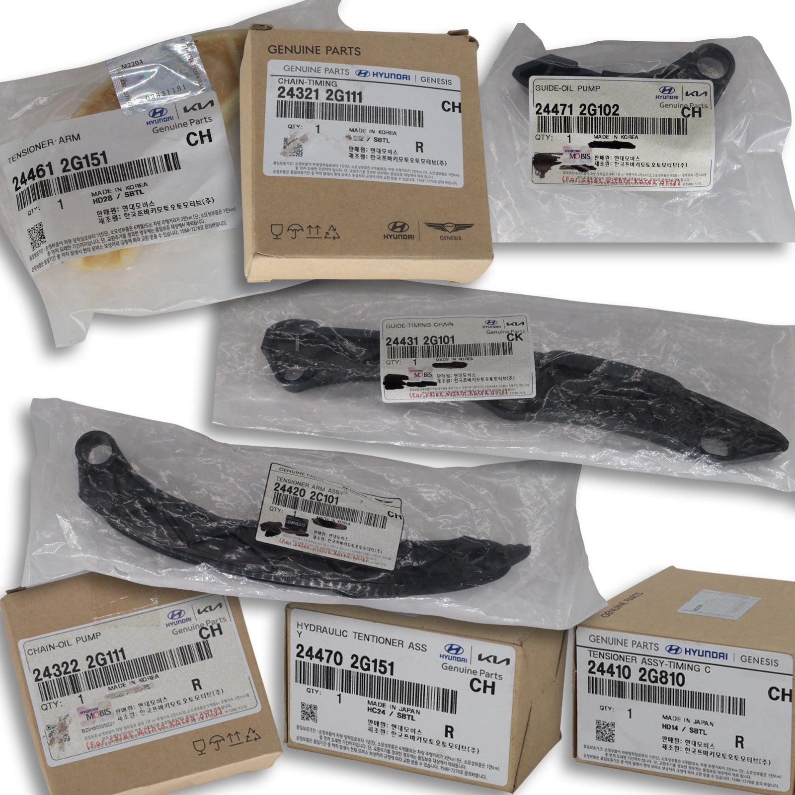 Collection of packaged automotive parts with visible brand labels on a white background